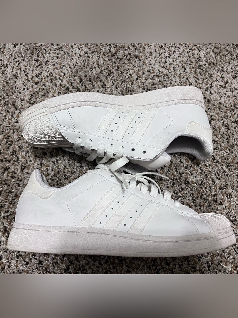 White Adidas Superstar sneakers